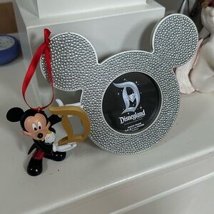 Mickey Mouse Ornament and a “Diamond Celebration” 3.4” round frame. SKU 137